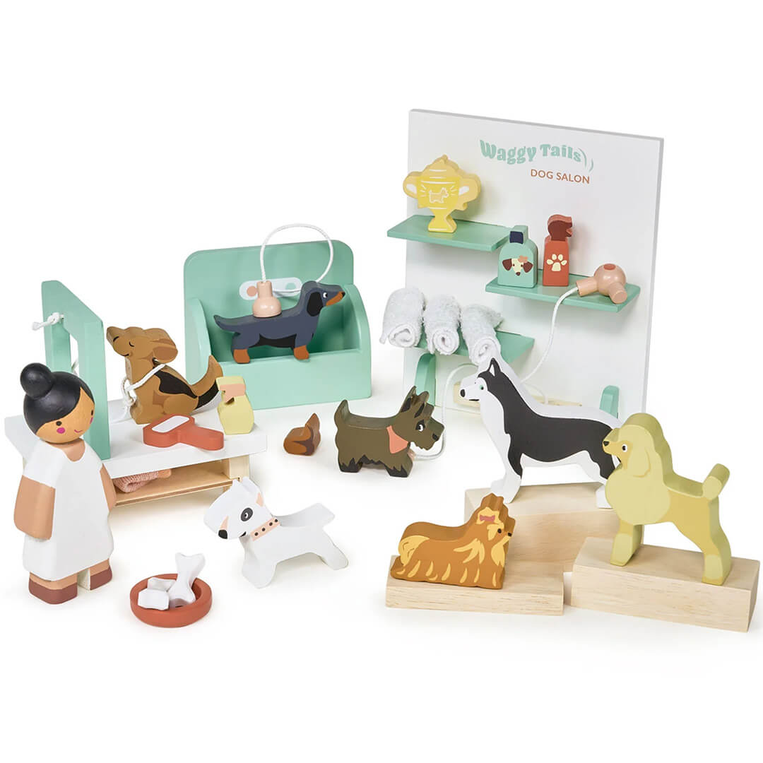 Tender Leaf Toys houten hondentrimsalon speelset met diverse hondenfiguren, een trimster en accessoires.