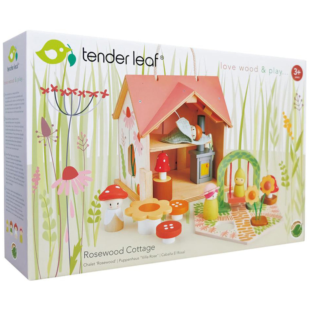 De verpakking van het Tender Leaf Toys houten poppenhuis Rosewood Cottage met afbeelding van het speelgoed.