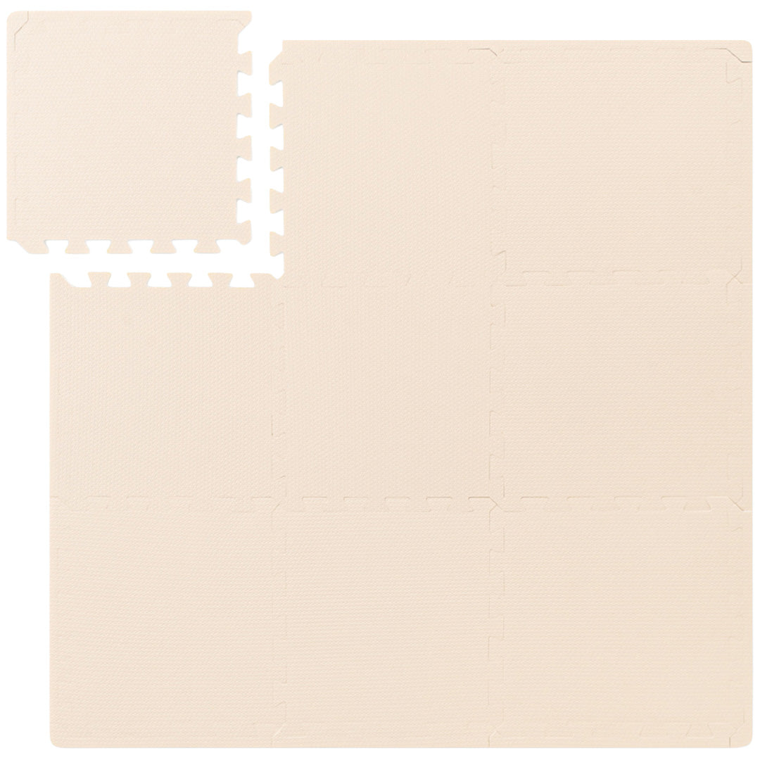 that's mine beige foam speelmat bestaande uit in elkaar grijpende puzzelstukken, van bovenaf gefotografeerd.