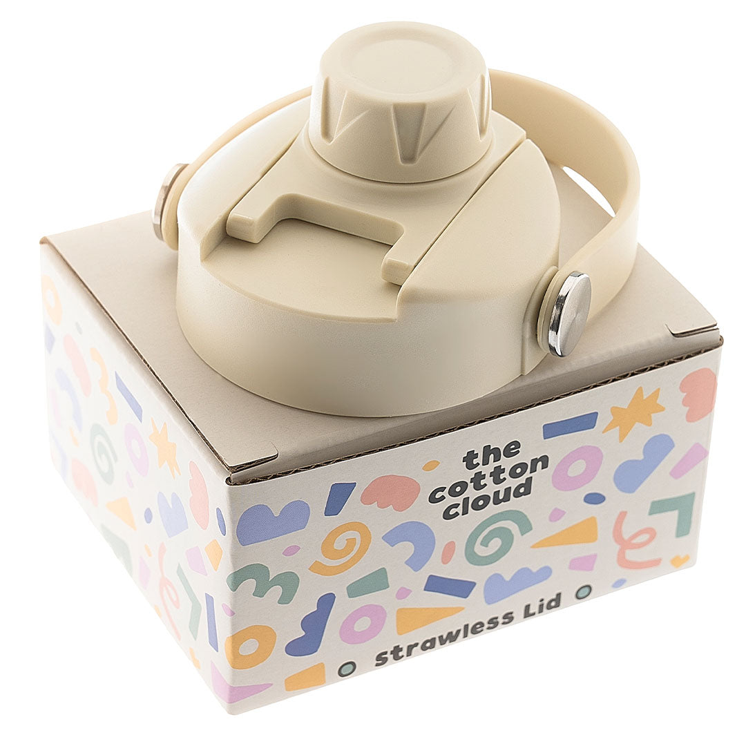 De the cotton cloud dop zonder rietje in beige kleur op de verpakking met kleurrijke patronen.