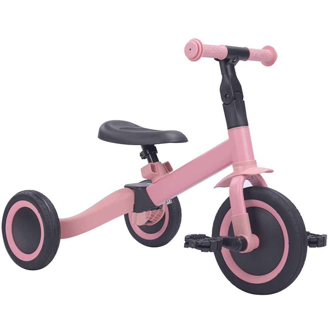 Topmark 4-in-1 roze driewieler met pedalen, schuin van voren gefotografeerd.
