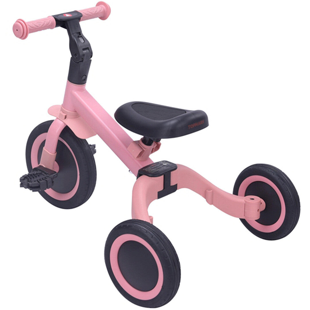 Topmark 4-in-1 roze driewieler met pedalen en twee achterwielen, schuin van voren gefotografeerd.