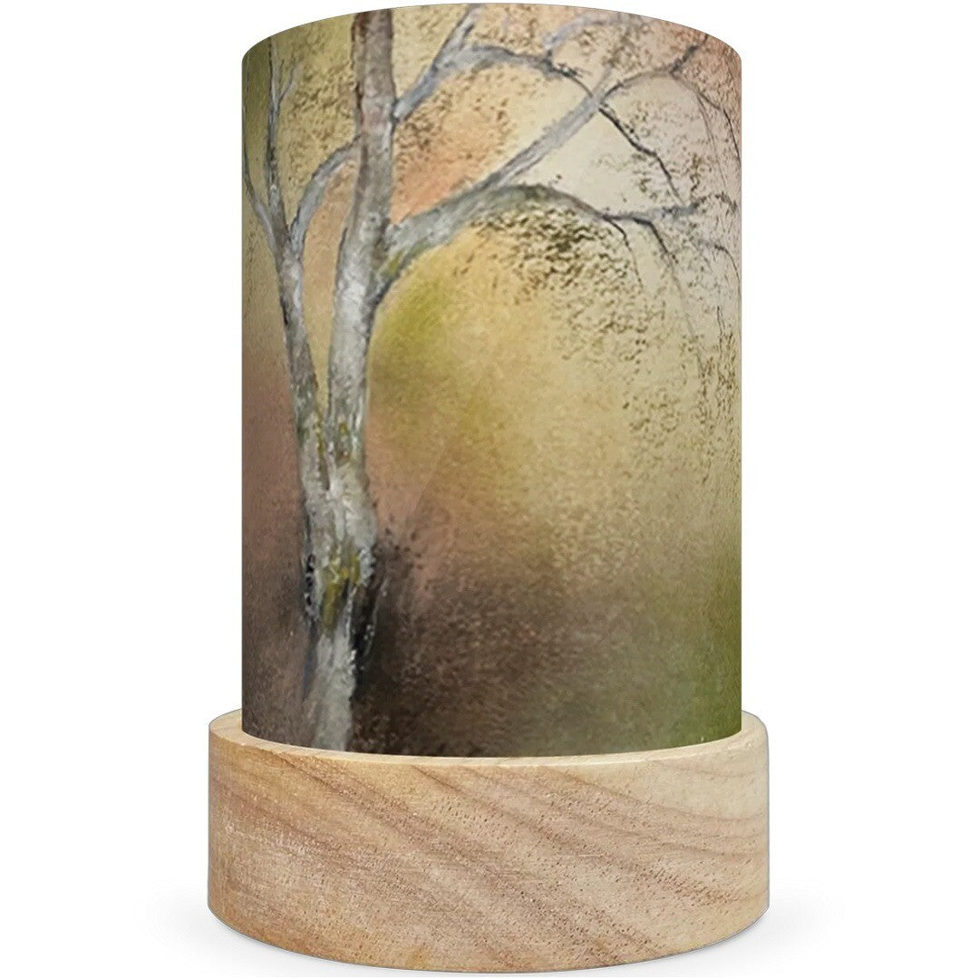 Een toverlux lichtkaart met een illustratie van een kale boom op een houten voetje.