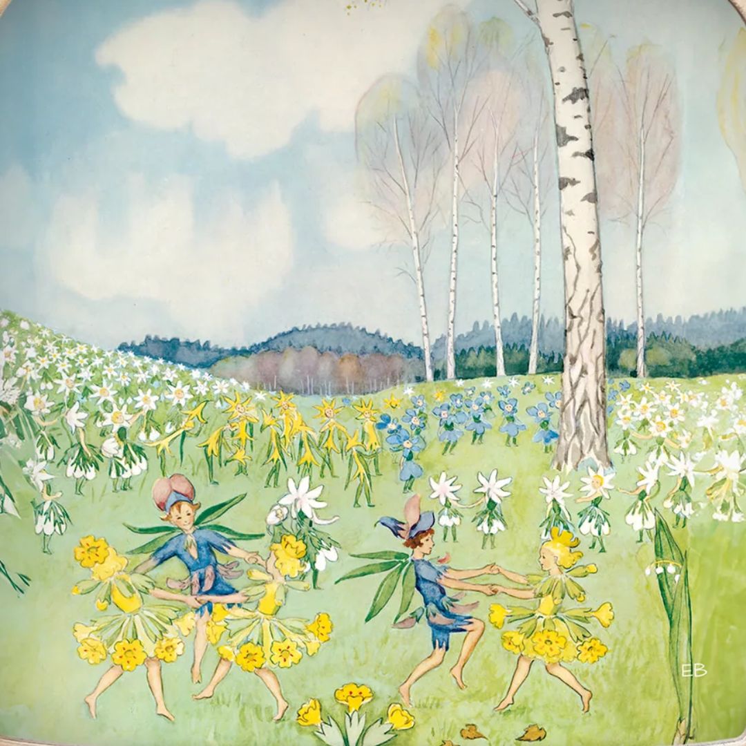 Toverlux toverplaat met een illustratie van dansende elfjes in een bloemenveld.