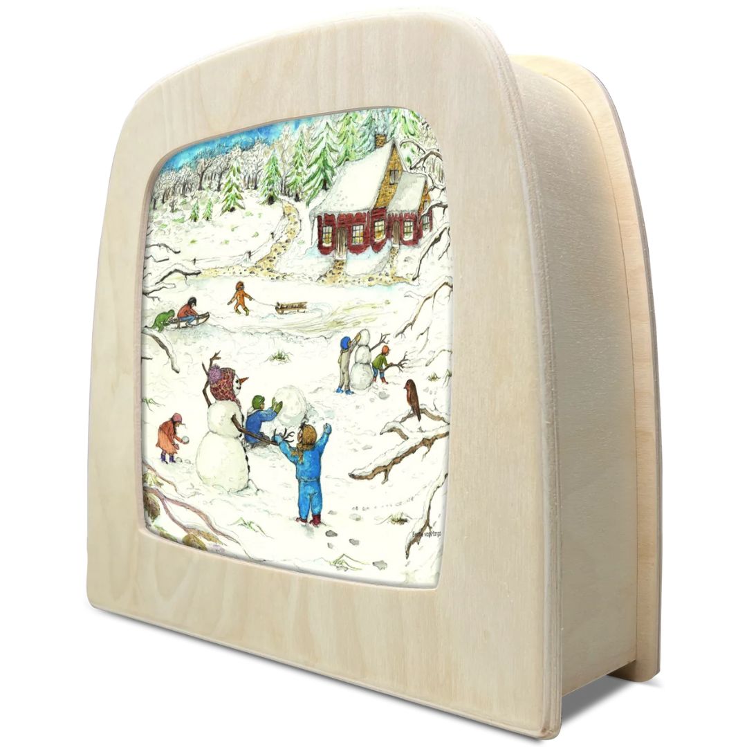 Toverlux toverplaat met de winterillustratie van een rood huis en spelende kinderen in de sneeuw.