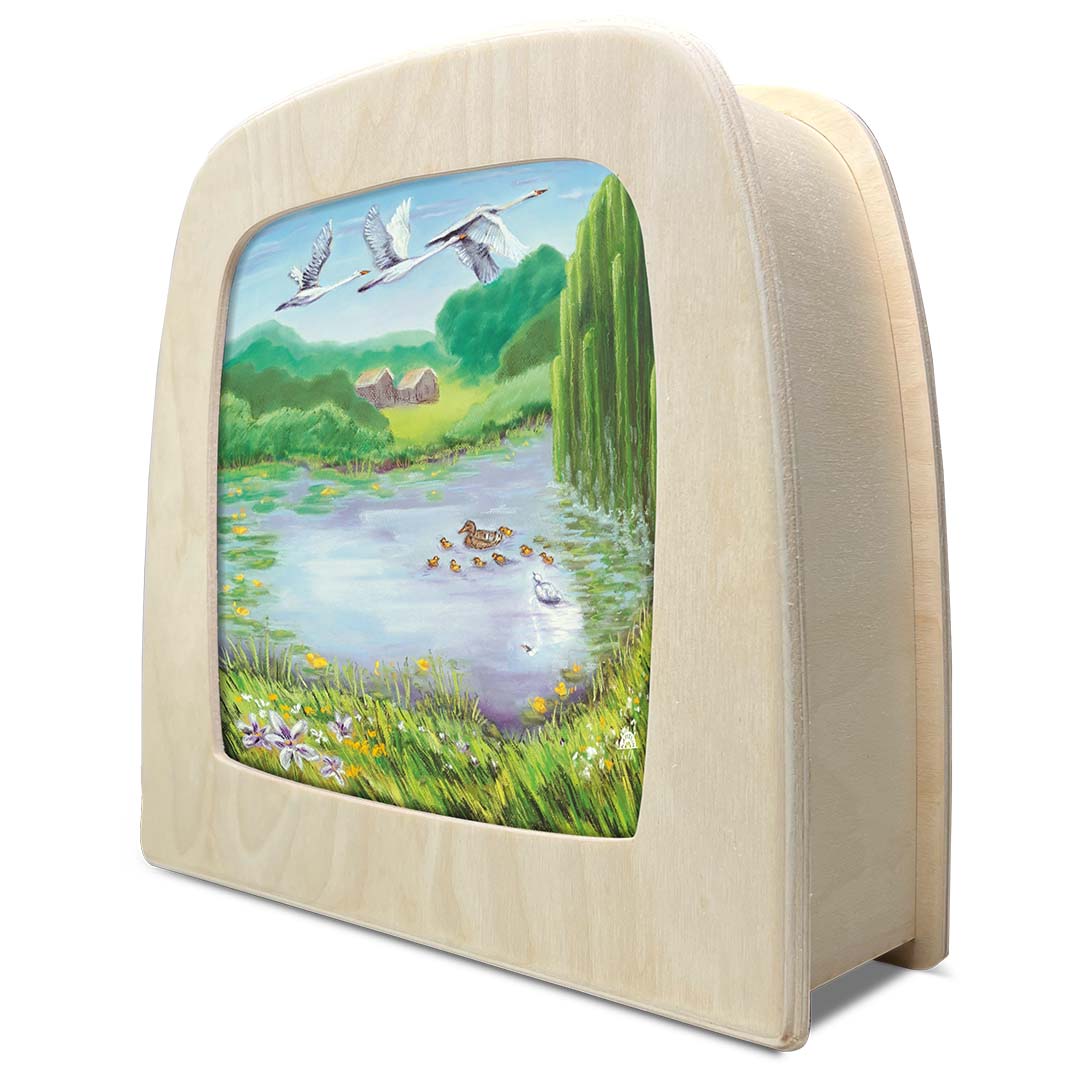 Zijaanzicht van de Toverlux toverplaat 'Het lelijke eendje' in een houten toverlamp.