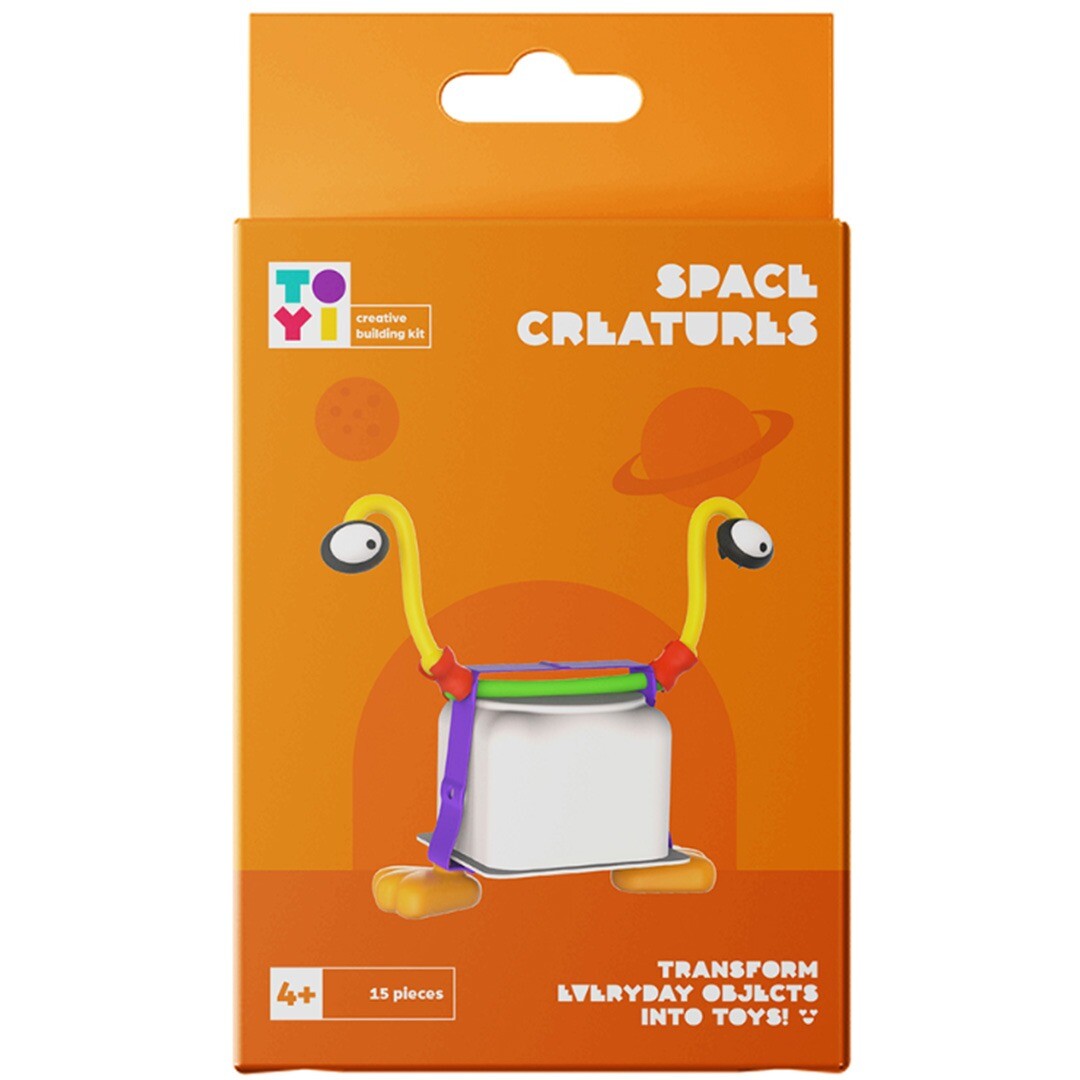 De oranje verpakking van de Toyi knutselset Space Creatures, met een afbeelding van een ruimtewezen gemaakt van alledaagse voorwerpen.