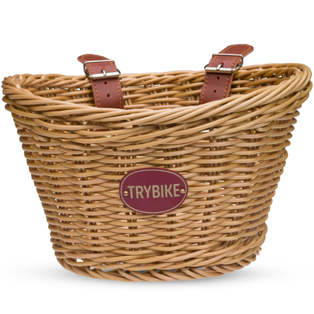 Trybike gevlochten kinderfietsmandje met leren riempjes en merklabel.