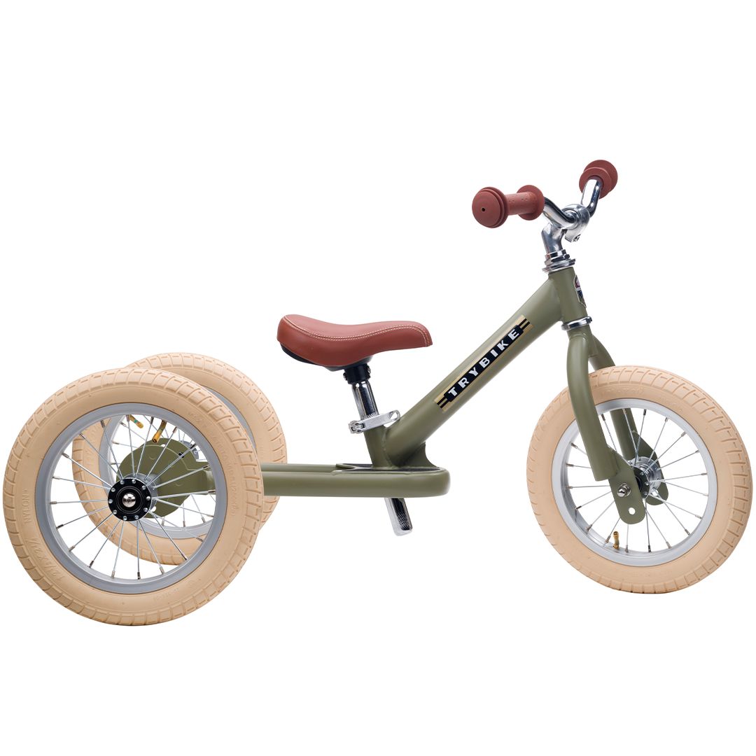 Trybike 2-in-1 loopfiets in vintage groen met bruin zadel en drie wielen.