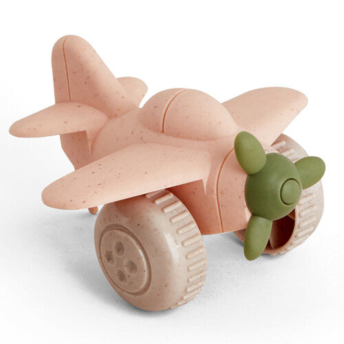 Een Viking Toys roze plastic speelgoedvliegtuig met beige wielen en een groene propeller.