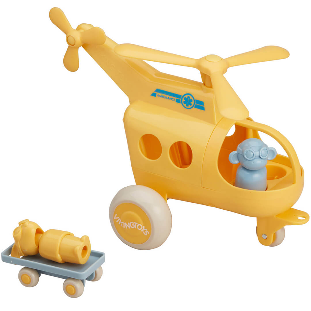 Viking Toys gele speelgoed traumahelikopter met een blauw figuur en een brancard op een karretje.