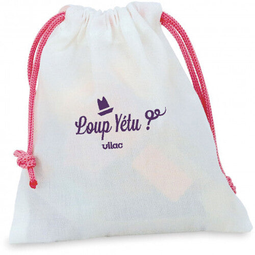 Wit stoffen zakje met roze trekkoorden en het Vilac 'Loup Yétu' logo.