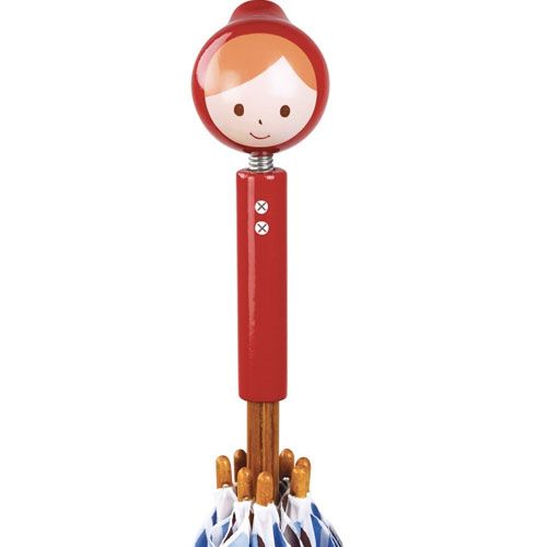 Detail van het rode handvat van de kinderparaplu met een Roodkapje figuur.