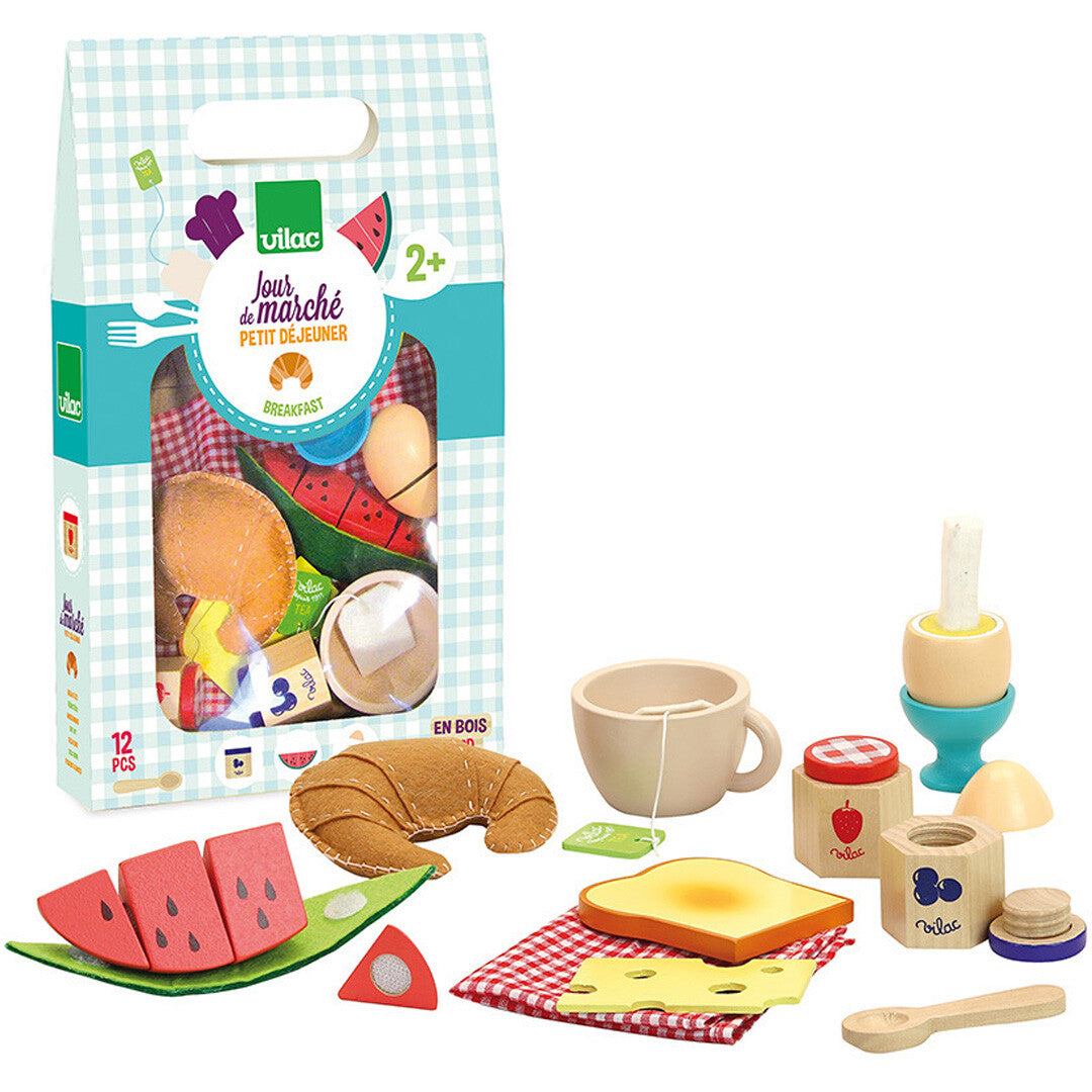 Verpakking van de Vilac houten ontbijtset met alle speelgoedproducten ernaast, zoals een croissant, watermeloen en theekopje.