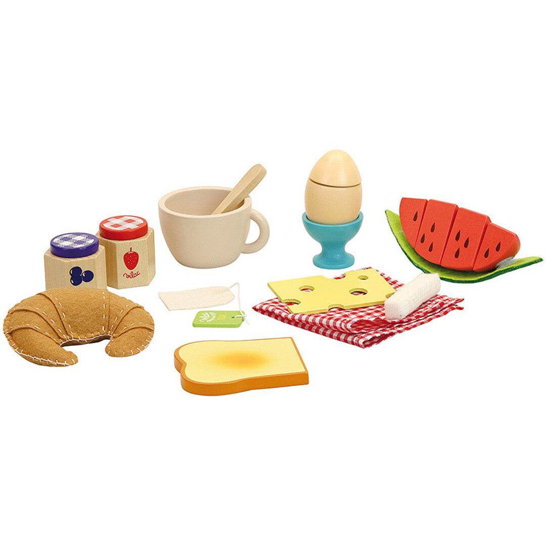 De Vilac houten ontbijtset met alle speelgoedonderdelen, waaronder een croissant, watermeloen, toast en een ei in eierdop.