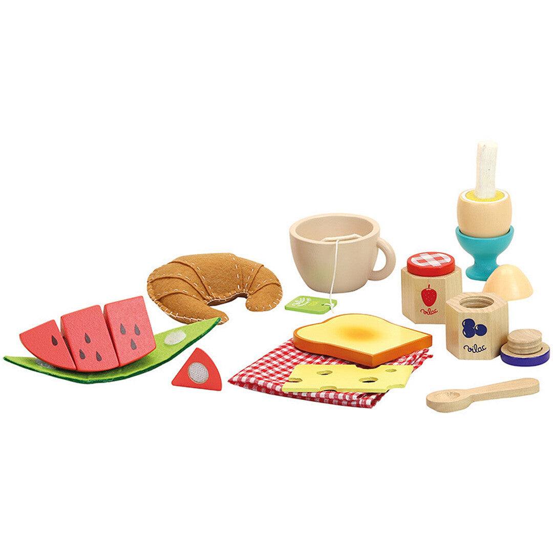 De Vilac houten ontbijtset met alle speelgoedonderdelen, zoals een croissant, watermeloen, theekopje en een ei in eierdop.
