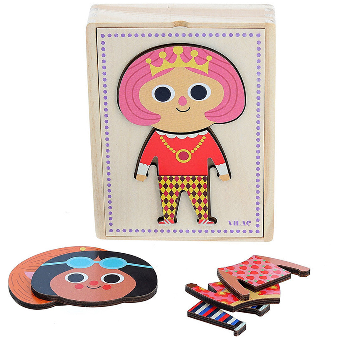 Vilac houten aankleedpop puzzel met een meisje met roze haar in de houten doos en losse hoofd- en kledingstukken ernaast.