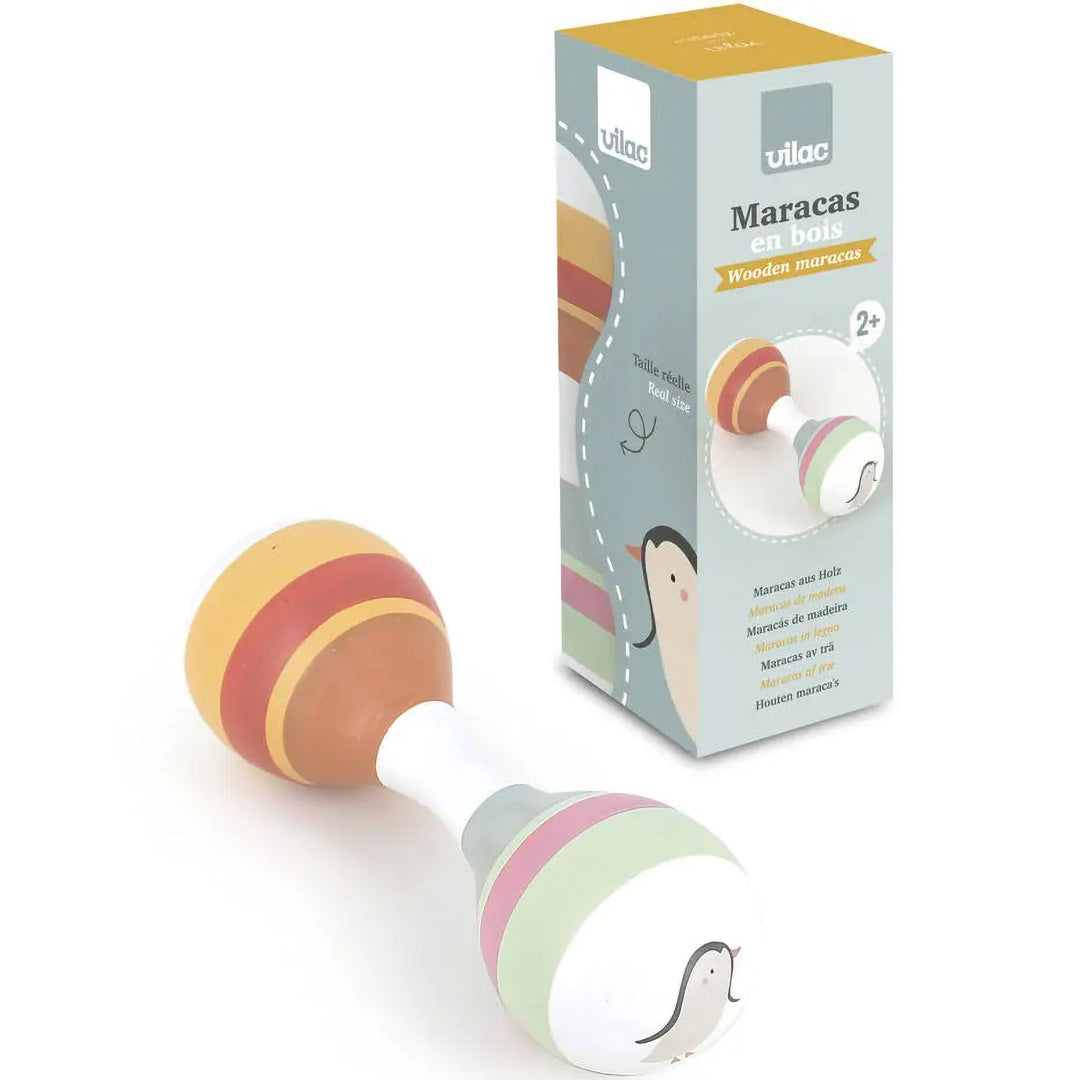 De verpakking van de Vilac houten rammelaar maraca met een afbeelding van het product en een pinguïn.