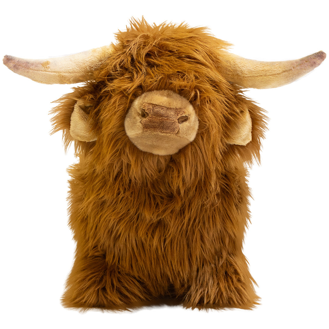 Wild & Soft skippydier Schotse Hooglander, een bruin harig speelgoedbeest met hoorns, van voren gefotografeerd.