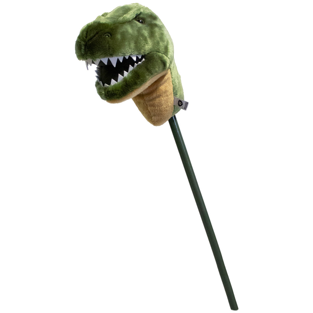 Wild & Soft pluche stokdier met een groene T-rex kop, schuin gefotografeerd.