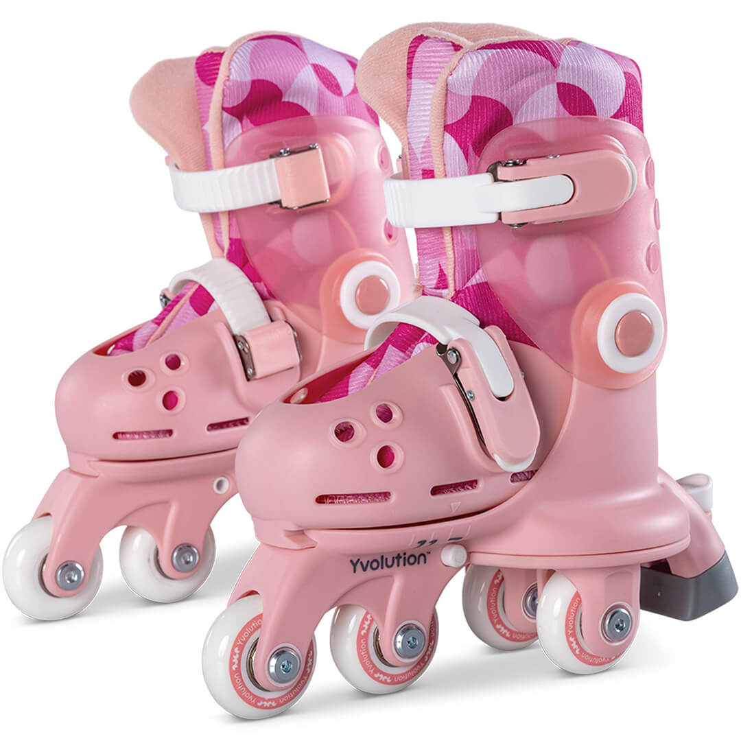 Een paar roze Yvolution kinderskeelers met roze en wit patroon op de binnenvoering.